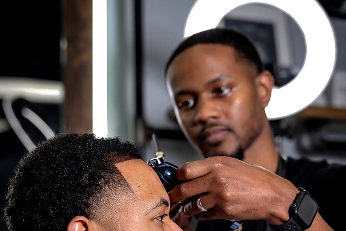 Precision lineup with detailers at Vanzant Barbershop Lounge