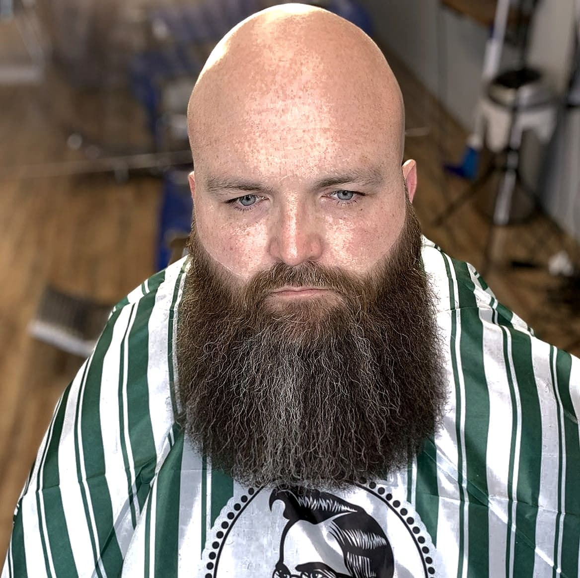 Full beard sculpt with clean cheek lines after a head shave