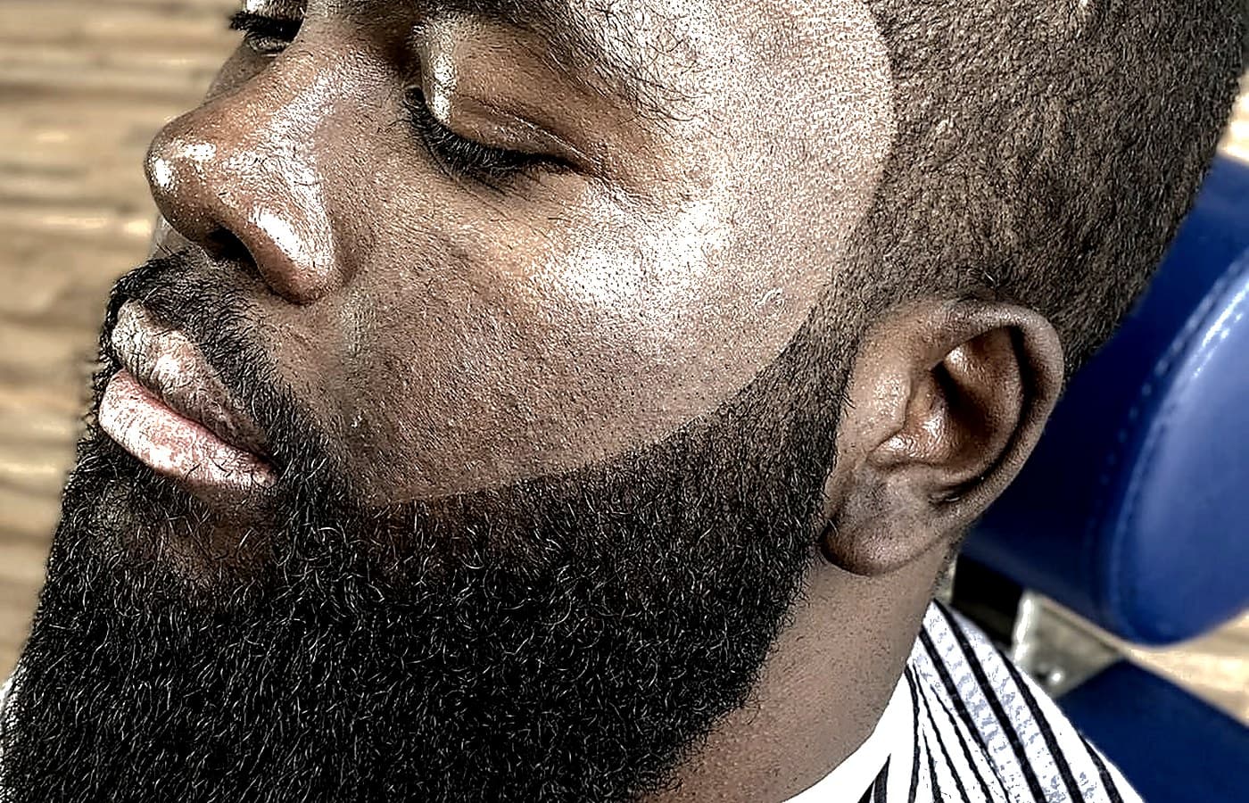 Precision beard cheek lineup and sculpting at Vanzant Barbershop Lounge