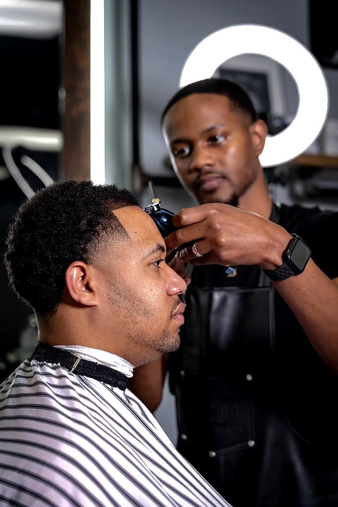 Precision lineup with detailers at Vanzant Barbershop Lounge