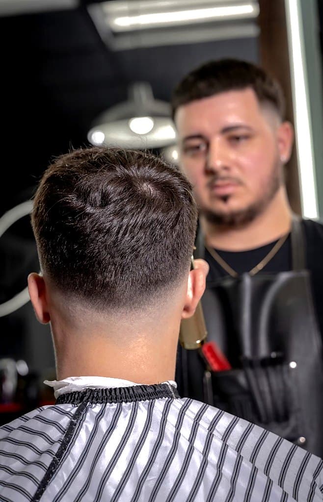 Close-up skin fade at the nape finished in the chair at Vanzant