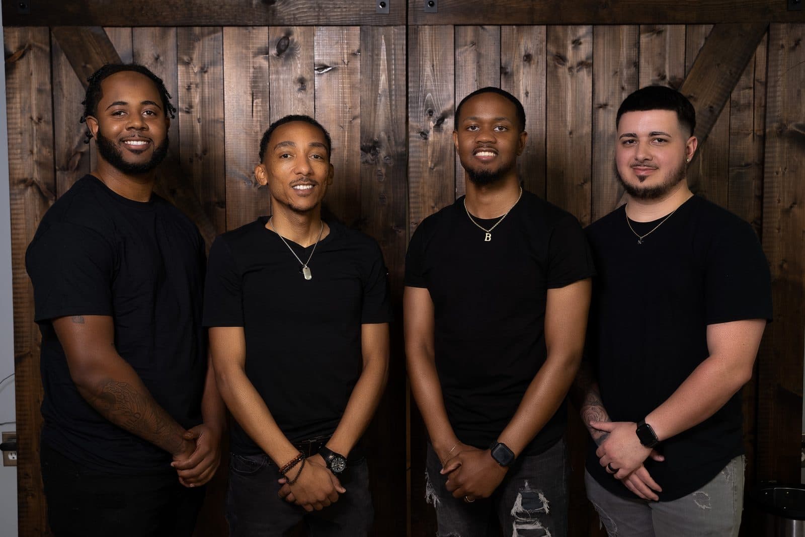 The Vanzant Barbershop Lounge team standing together