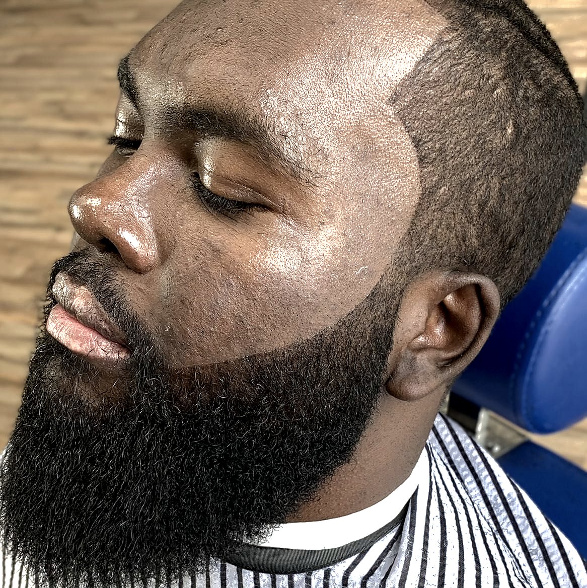 Sharp cheek beard lineup and sculpted edges at Vanzant