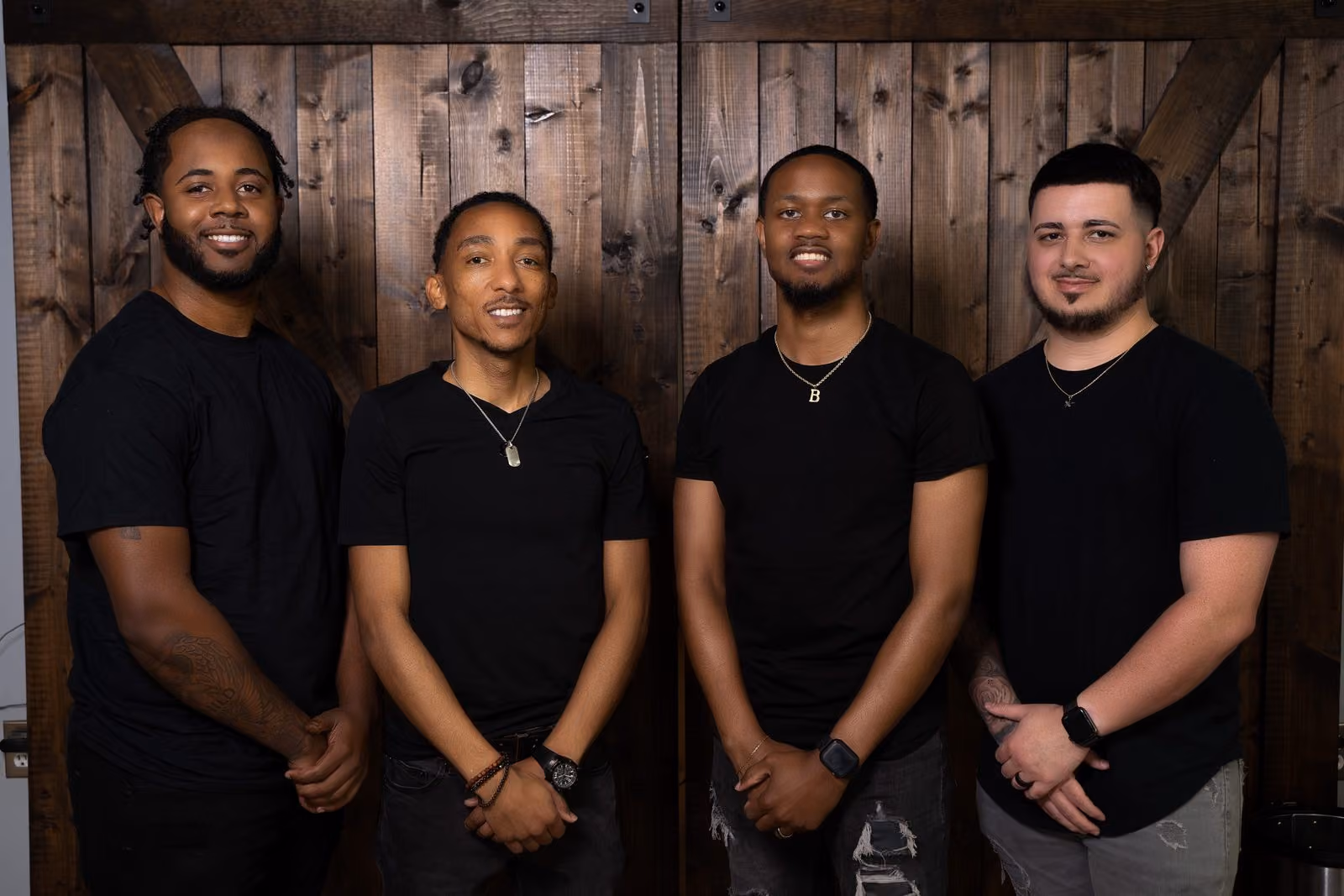 The Vanzant Barbershop Lounge team standing together