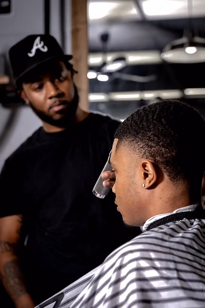 Sharp forehead lineup and fade detail work in the lounge Sharp forehead lineup and fade detail work in the lounge