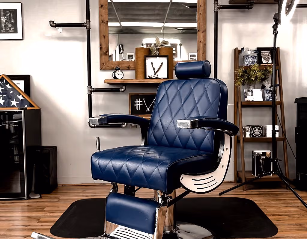 Blue diamond-quilted barber chair at Vanzant Barbershop Lounge in Tupelo Blue diamond-quilted barber chair at Vanzant Barbershop Lounge in Tupelo