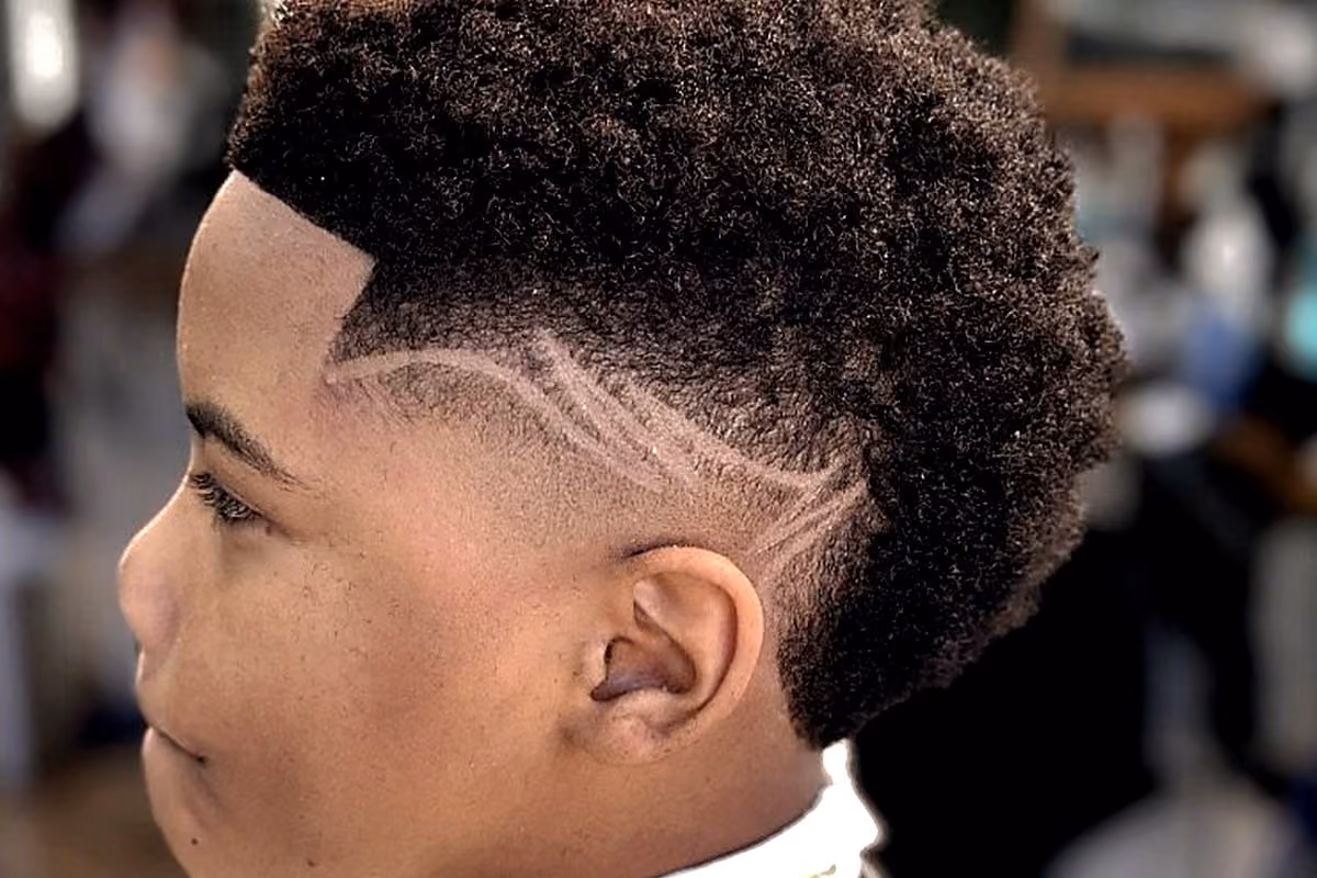 Close-up kids skin fade and lineup detail from a Vanzant lounge cut